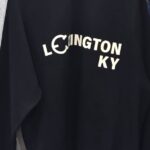 Black sweatshirt with 'Lexington KY' text on the front.