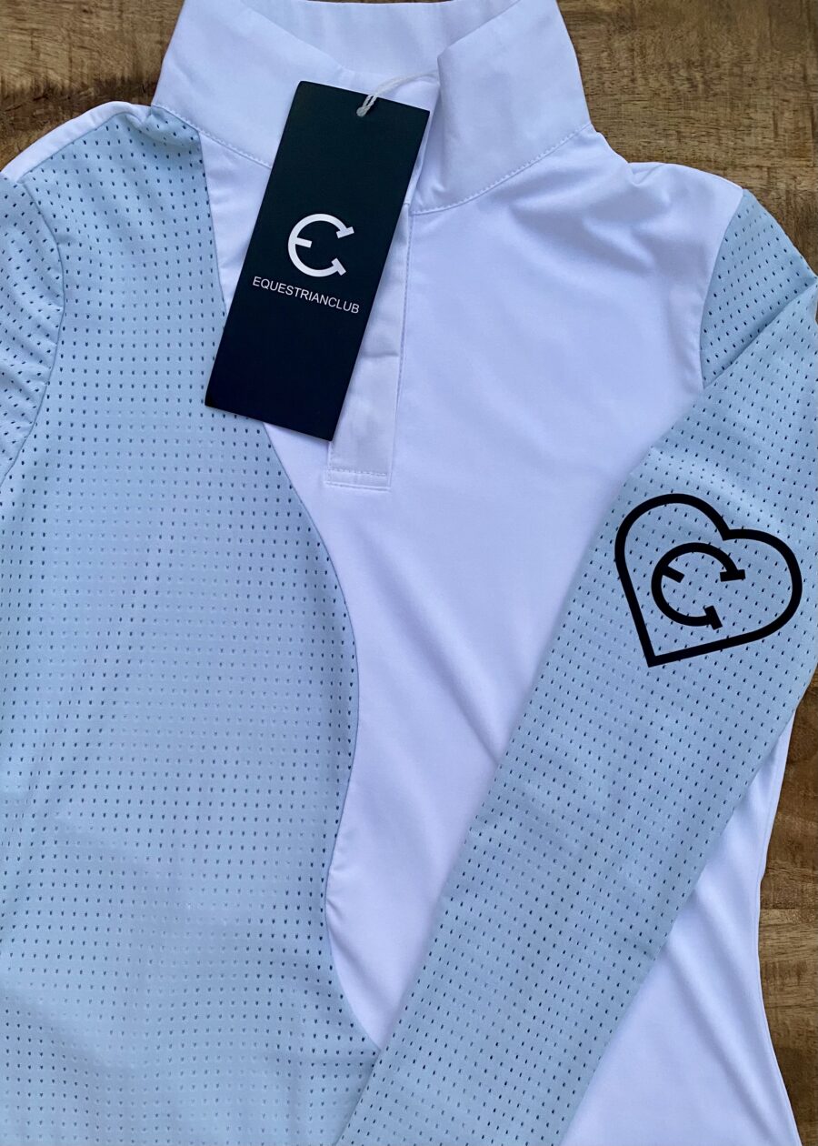 A sporty shirt with light blue checkered sleeves and a heart-shaped logo.