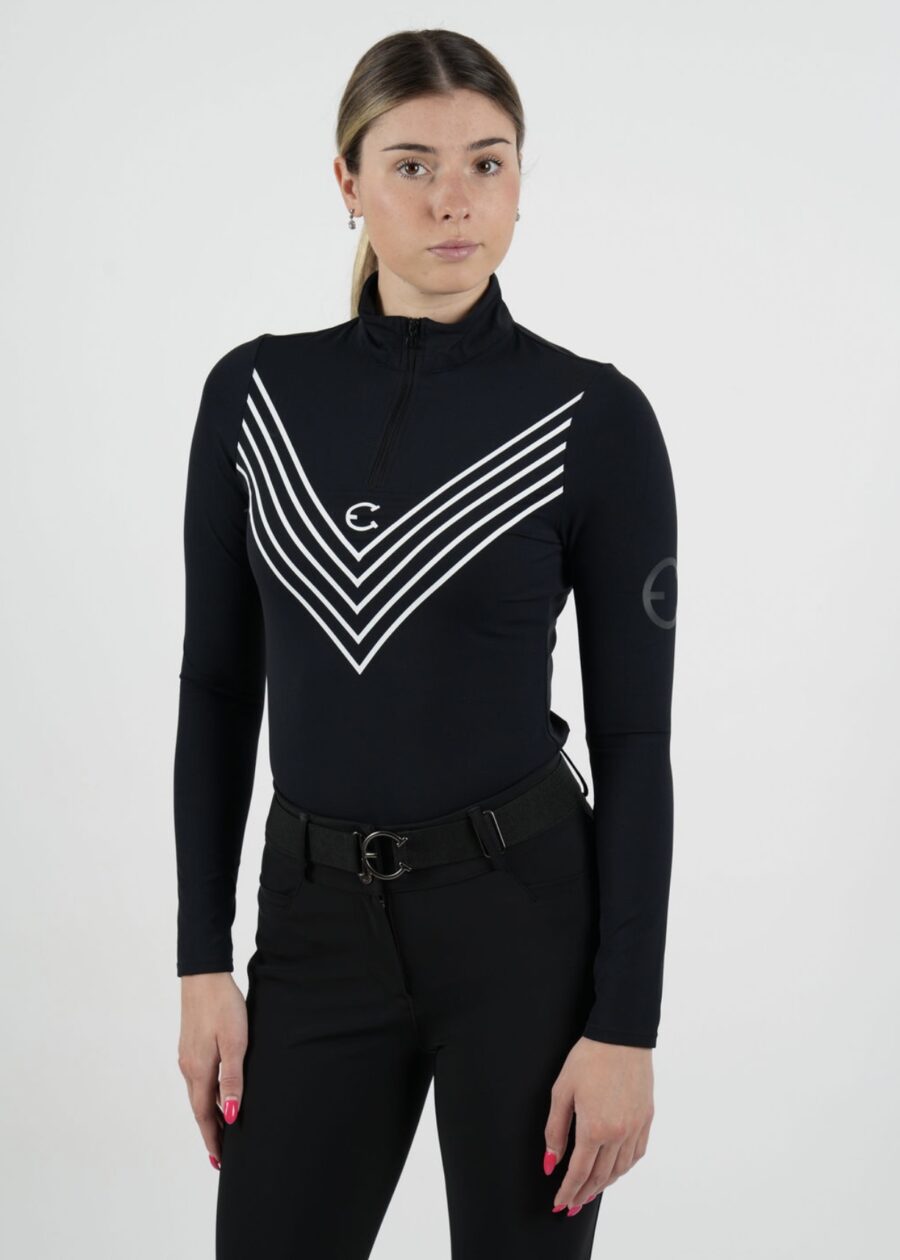 Person wearing a black turtleneck with white chevron stripes and black pants.