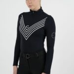 Person wearing a black turtleneck with white chevron patterns.